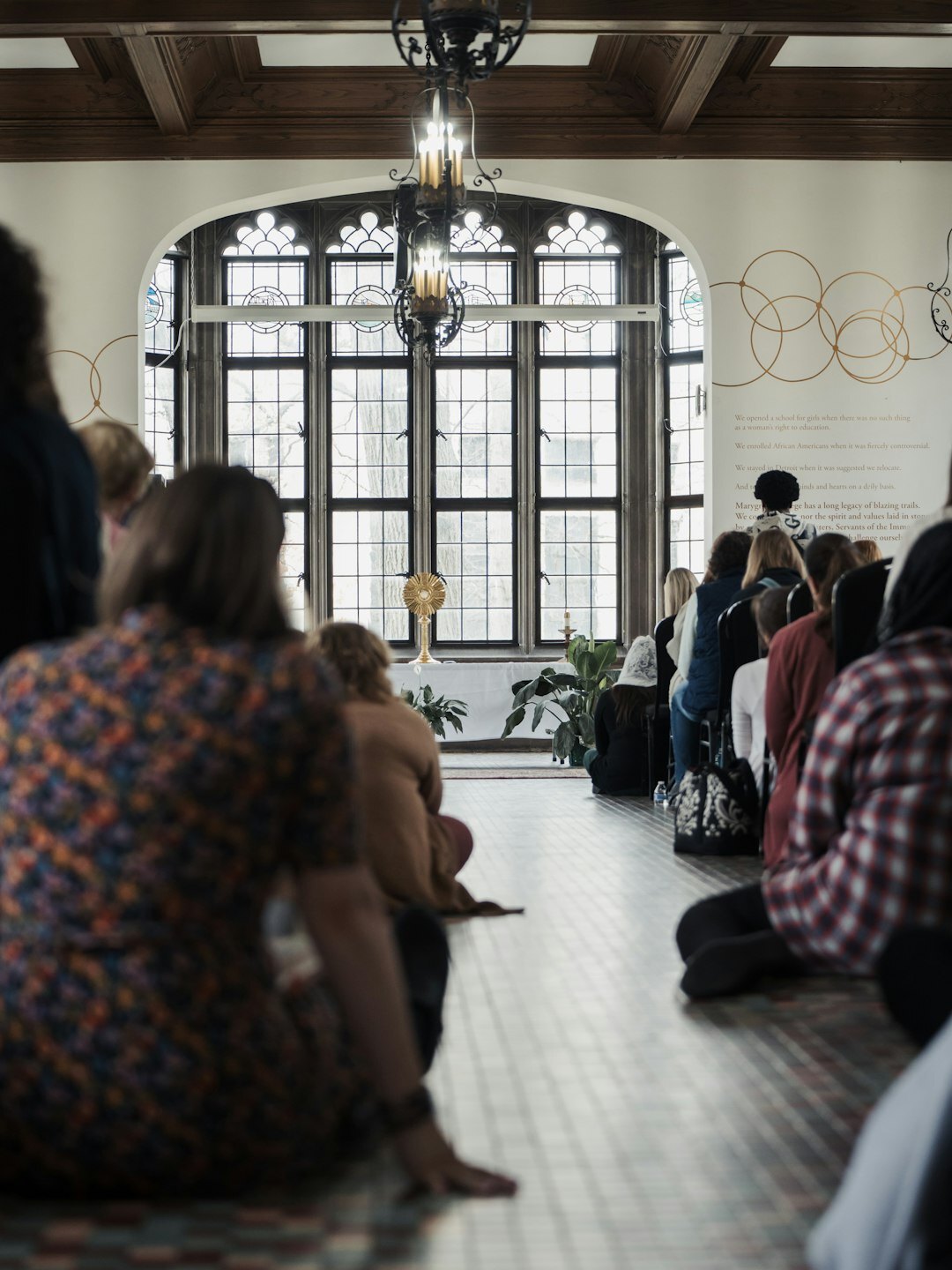 Diverse group of adults sitting in a circle at a community storytelling workshop