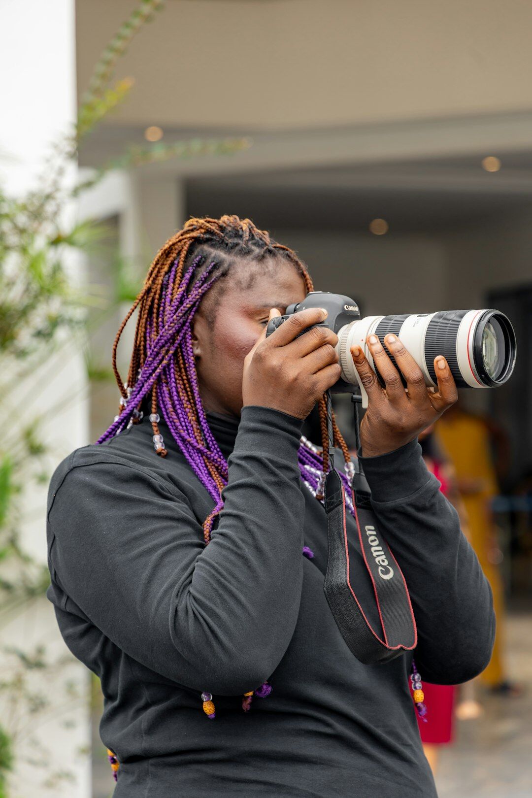 Portrait of a Danish female documentary photographer holding a camera